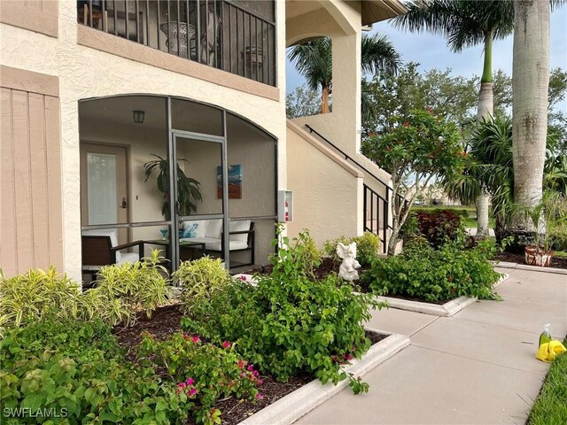 entrance to property with a balcony