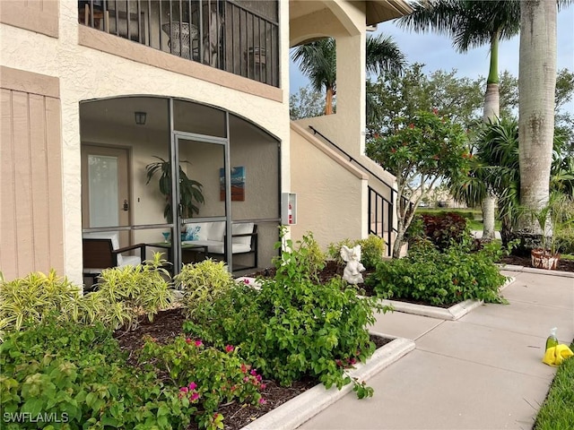 13268 Whitehaven Ln Unit 102, Fort Myers, FL 33966 - view of side of property featuring stucco siding
