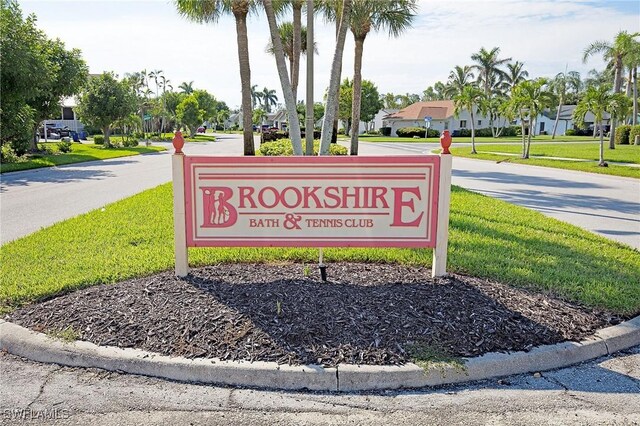 13268 Whitehaven Ln Unit 102, Fort Myers, FL 33966 - community sign featuring a yard and a residential view