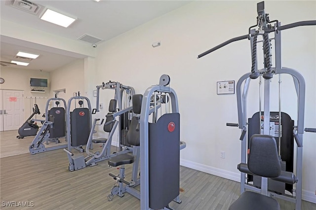 13268 Whitehaven Ln Unit 102, Fort Myers, FL 33966 - gym with wood finished floors and baseboards