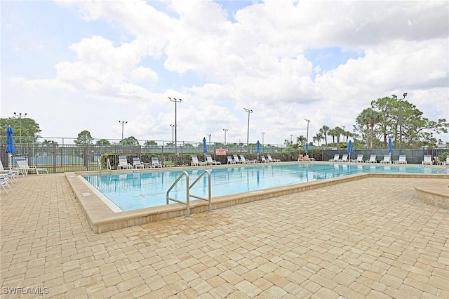 13268 Whitehaven Ln Unit 102, Fort Myers, FL 33966 - community pool featuring a patio