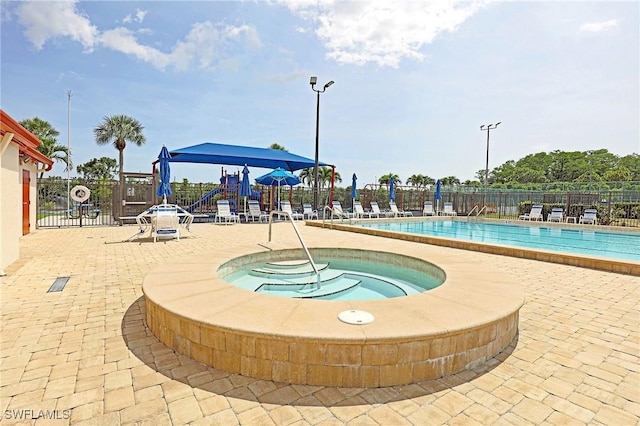 13268 Whitehaven Ln Unit 102, Fort Myers, FL 33966 - community pool with a community hot tub and a patio