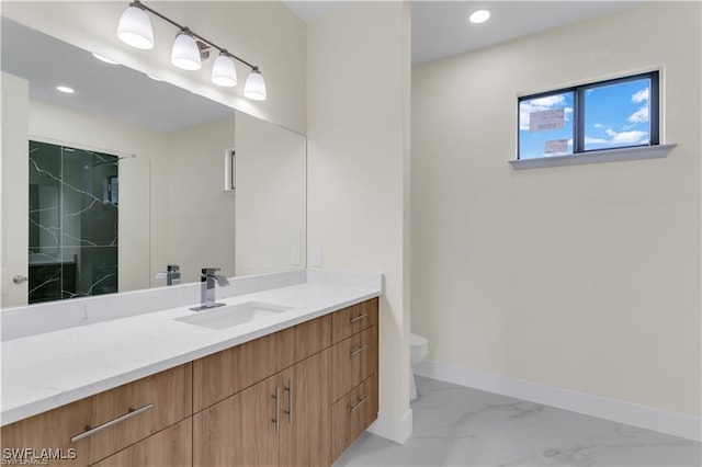 bathroom featuring vanity and toilet