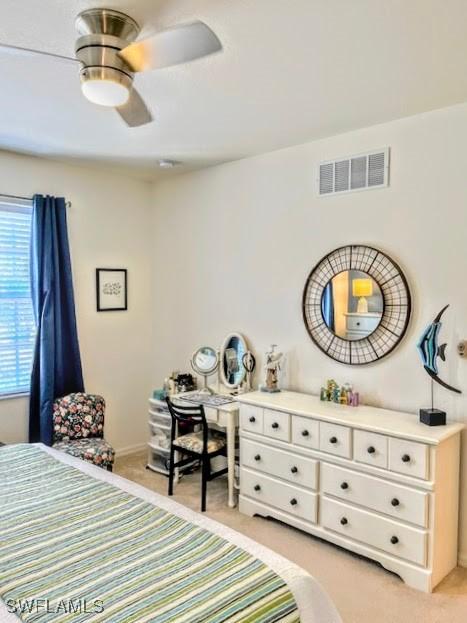 carpeted bedroom featuring ceiling fan