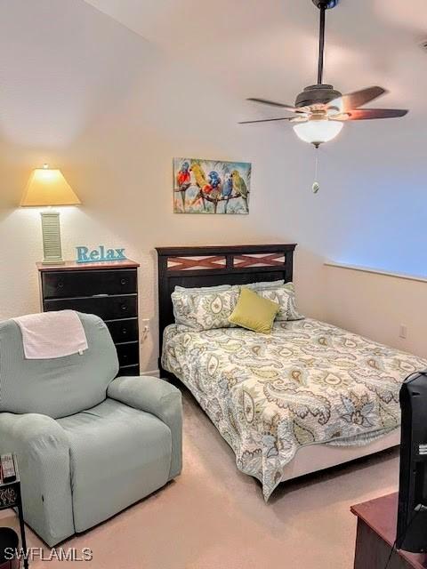 bedroom featuring ceiling fan and carpet