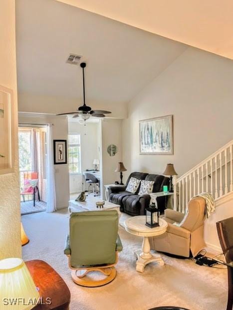 living room featuring carpet flooring, ceiling fan, and high vaulted ceiling