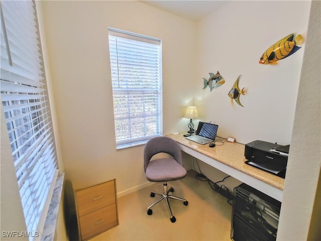 office area with a healthy amount of sunlight and carpet