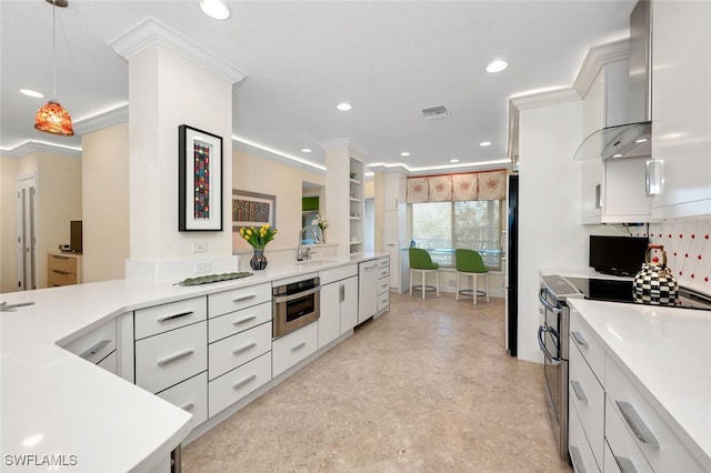 kitchen featuring pendant lighting, white cabinets, ornamental molding, appliances with stainless steel finishes, and tasteful backsplash