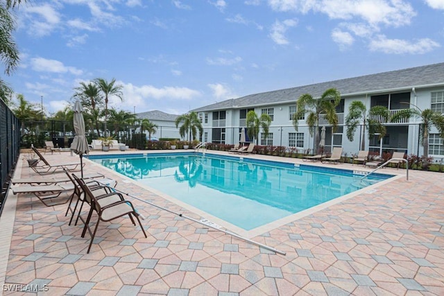 view of swimming pool featuring a patio area