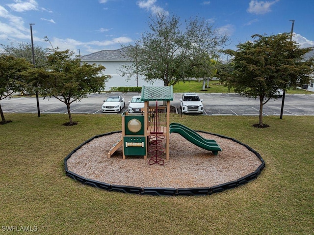 view of play area featuring a lawn