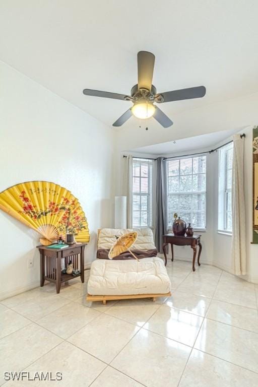 tiled bedroom with ceiling fan