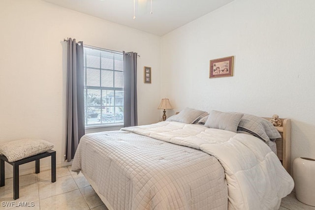 bedroom with light tile patterned floors