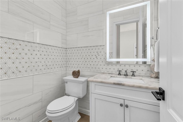 1631 Galleon Ct, Marco Island, FL 34145 - half bathroom featuring vanity and tile walls