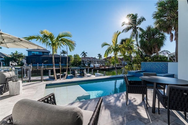 1631 Galleon Ct, Marco Island, FL 34145 - outdoor pool with a water view and a patio
