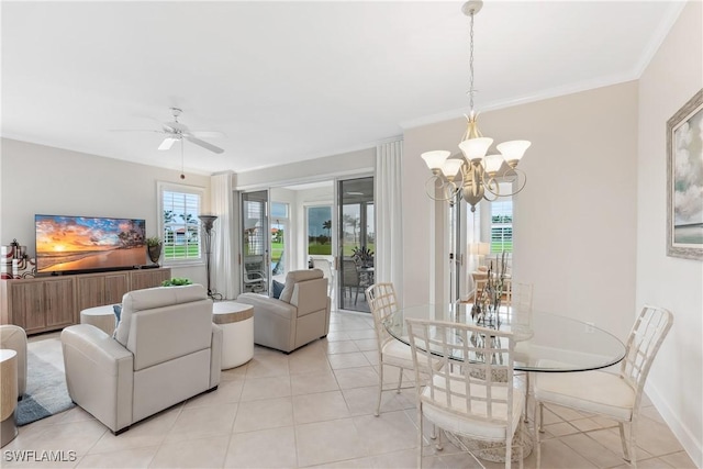 living area with a healthy amount of sunlight, baseboards, ornamental molding, and ceiling fan with notable chandelier