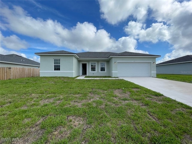 ranch-style house featuring a garage and a front lawn