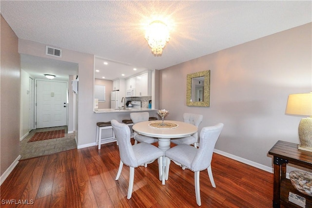 dining room featuring dark hardwood / wood-style flooring