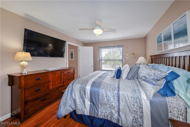 bedroom featuring ceiling fan and dark hardwood / wood-style floors