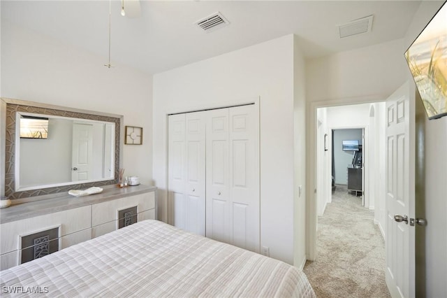 carpeted bedroom featuring a closet