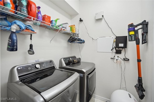 washroom featuring washer and clothes dryer