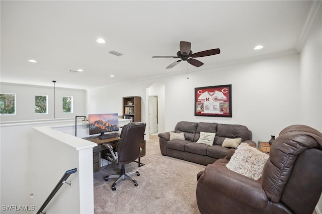 carpeted home office with ceiling fan and ornamental molding