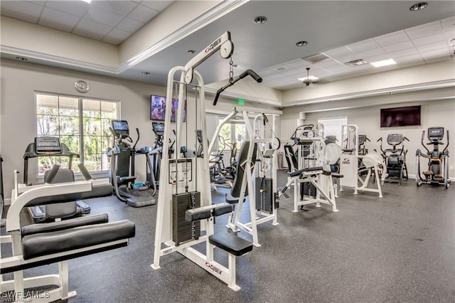 exercise room featuring a paneled ceiling