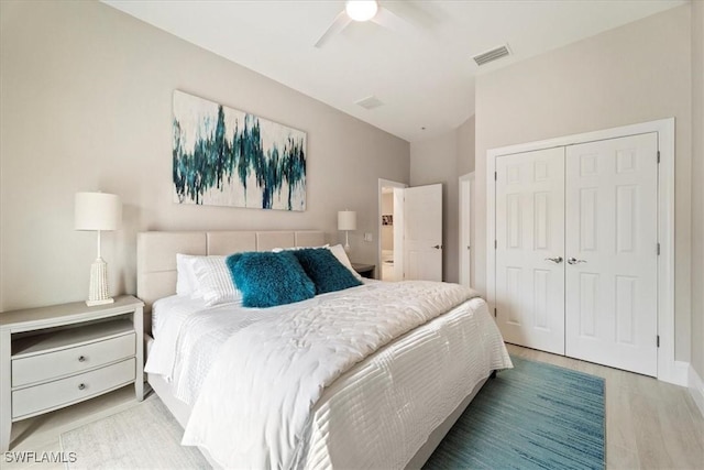 bedroom with ceiling fan, a closet, and hardwood / wood-style flooring