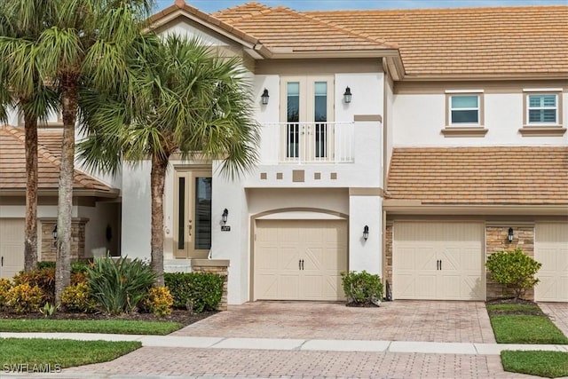 view of front of house with a balcony and a garage