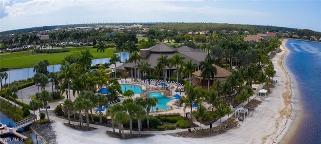 bird's eye view featuring a water view and a view of the beach