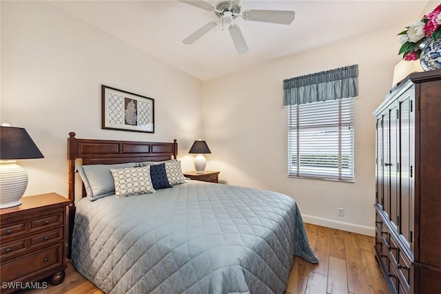 bedroom featuring ceiling fan and light hardwood / wood-style floors