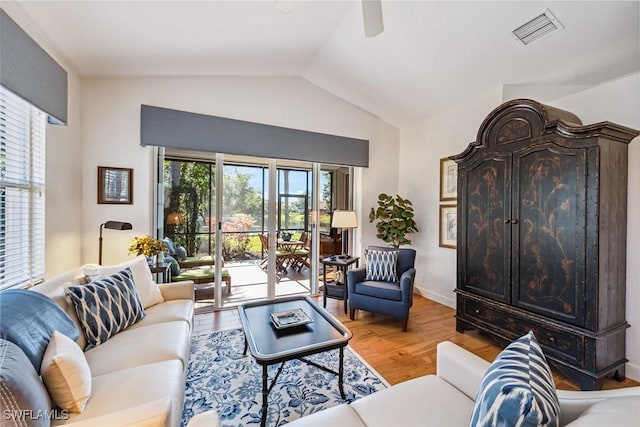 living room featuring hardwood / wood-style floors and lofted ceiling