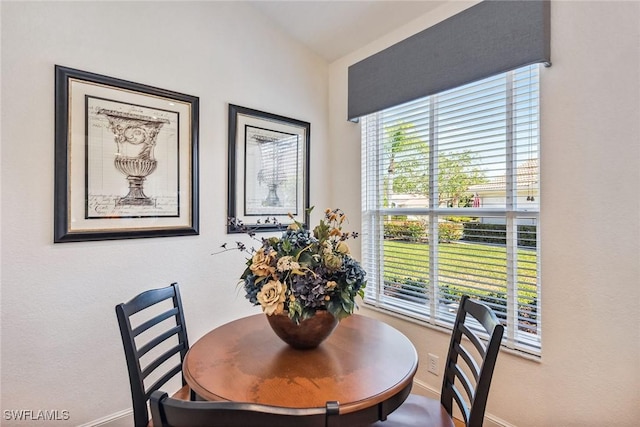 dining area with lofted ceiling