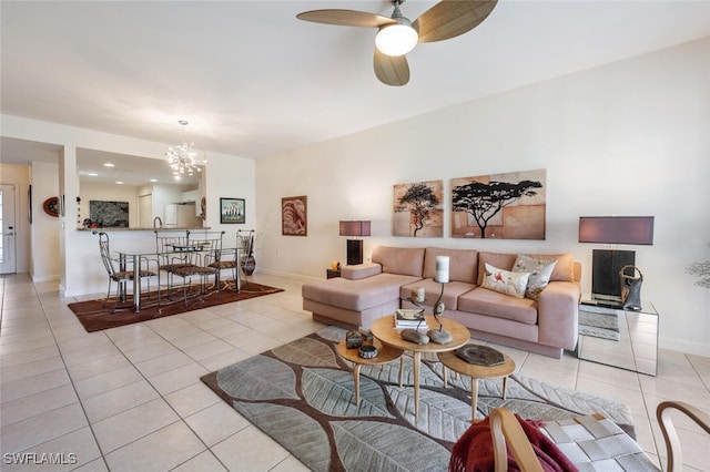 tiled living room featuring ceiling fan with notable chandelier