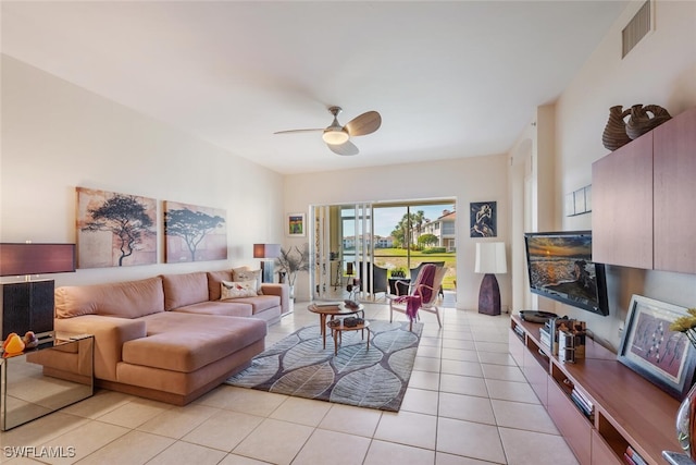 living room featuring ceiling fan and light tile patterned flooring