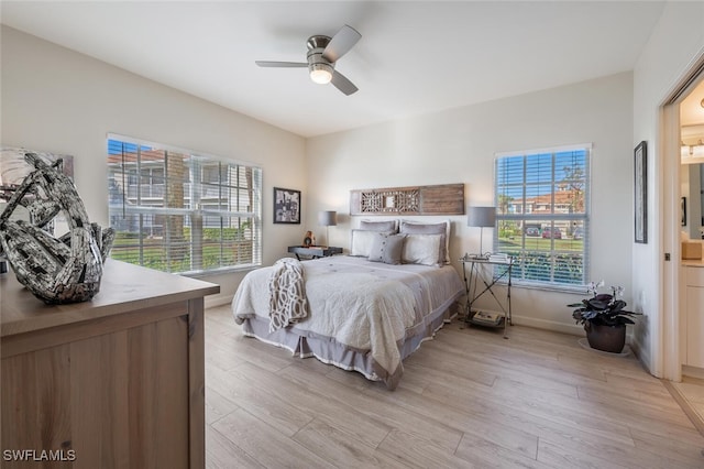 bedroom featuring light hardwood / wood-style floors and ceiling fan