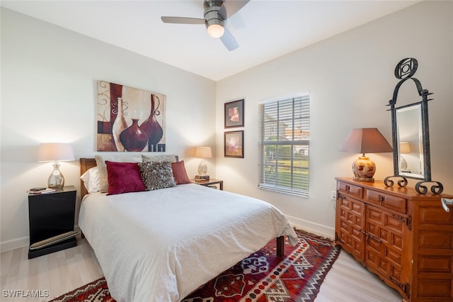 bedroom featuring light hardwood / wood-style flooring and ceiling fan