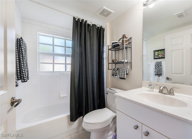 full bathroom with shower / tub combo with curtain, vanity, and toilet