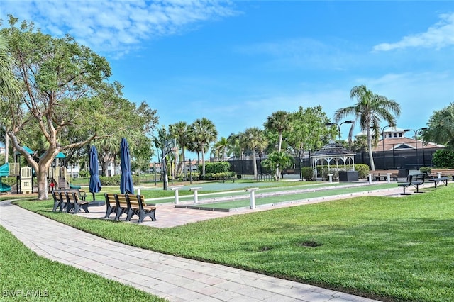 view of property's community with a lawn and a gazebo