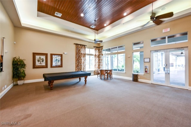 recreation room featuring ceiling fan, wooden ceiling, billiards, a tray ceiling, and carpet