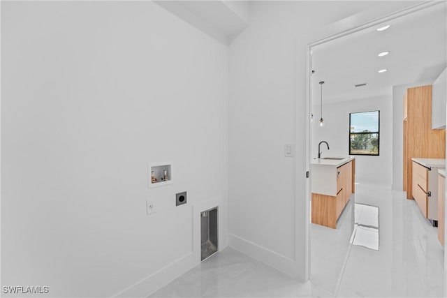 laundry area featuring hookup for a washing machine, sink, and hookup for an electric dryer