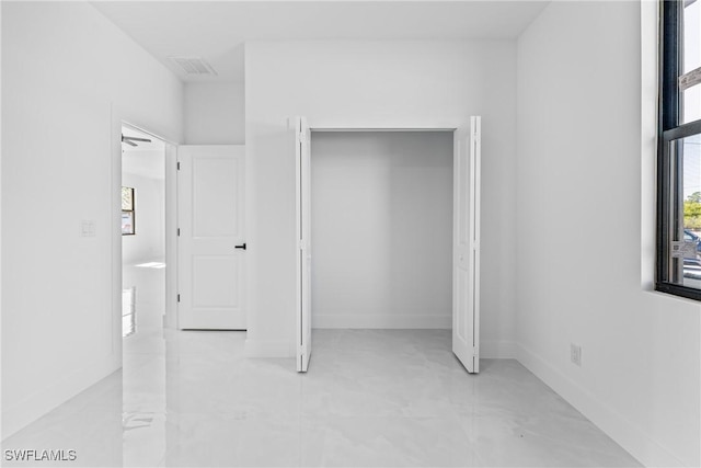 unfurnished bedroom with a closet