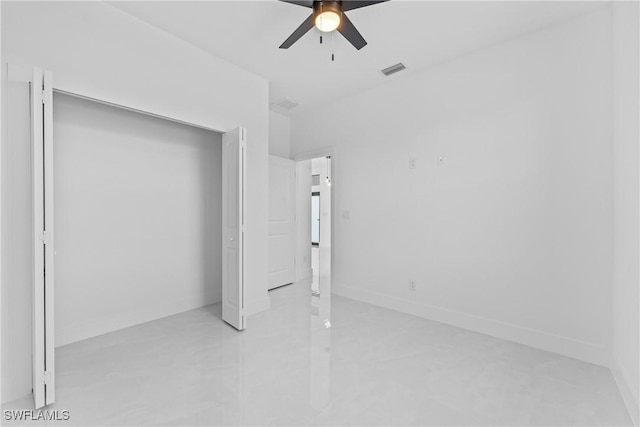 unfurnished bedroom featuring a closet and ceiling fan