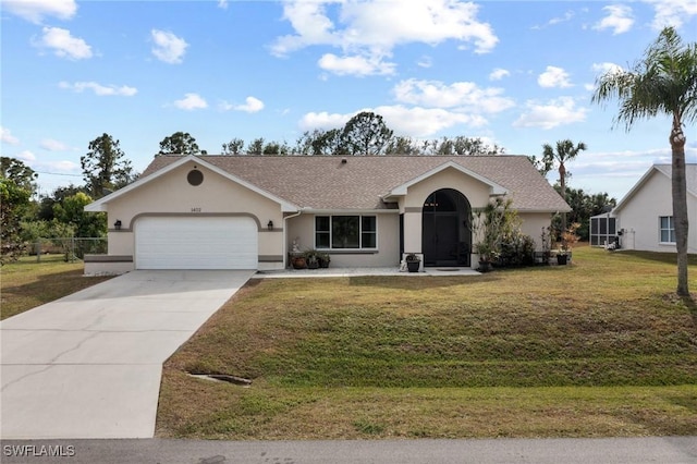 ranch-style house featuring a front yard and a garage