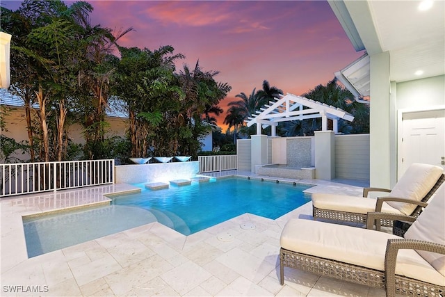 pool at dusk with a patio