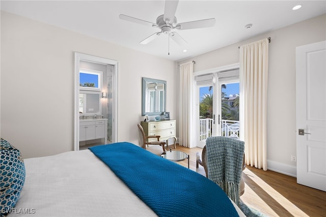 bedroom featuring hardwood / wood-style flooring, ceiling fan, access to exterior, and ensuite bath