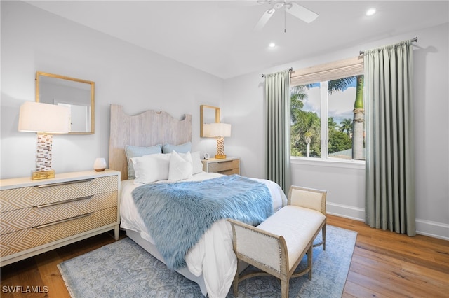 bedroom featuring ceiling fan and hardwood / wood-style floors