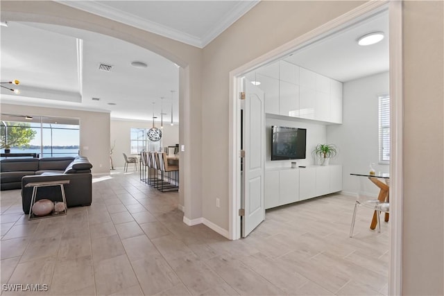 hallway featuring crown molding