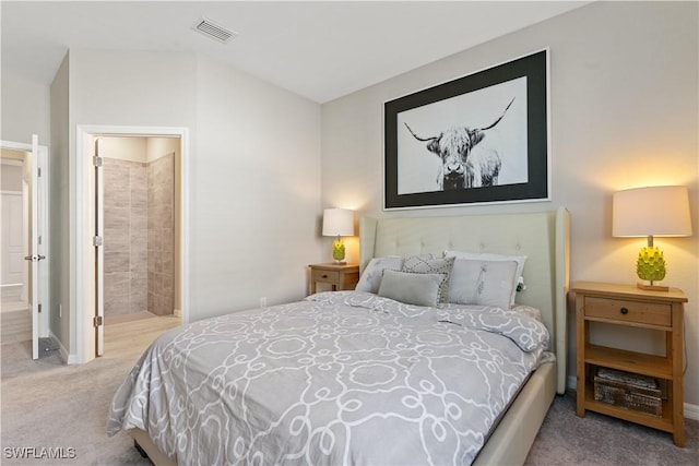 bedroom featuring carpet flooring and ensuite bathroom