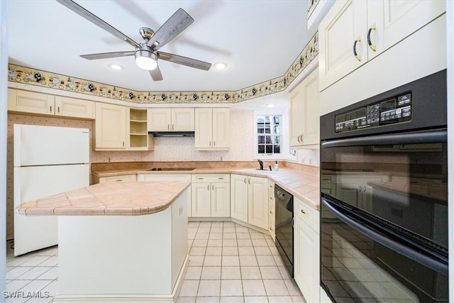 kitchen with sink, black appliances, light tile patterned floors, tile countertops, and a center island