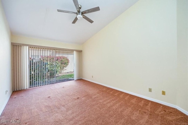 carpeted empty room featuring ceiling fan and lofted ceiling